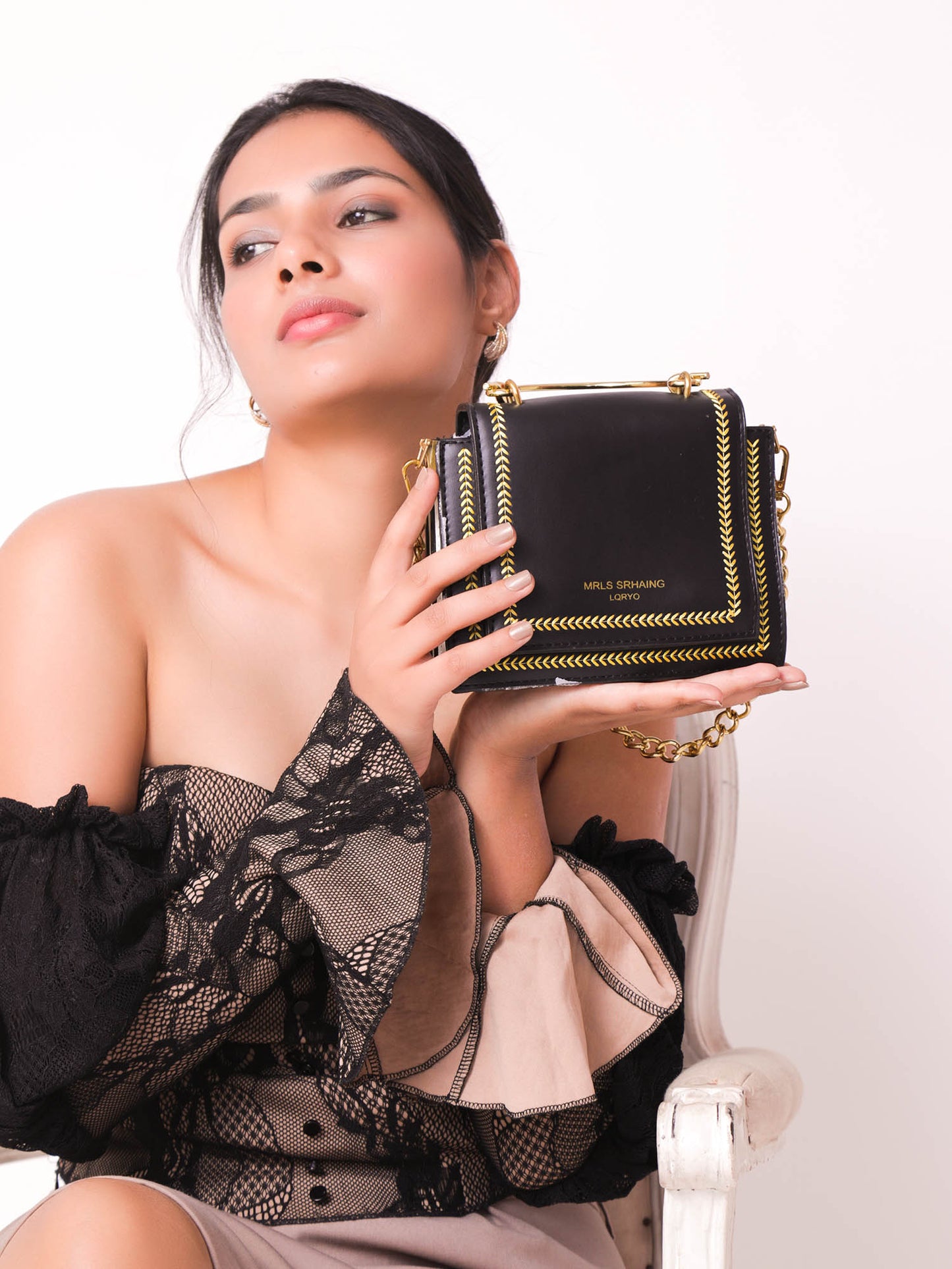 The Graceful Stitched Embroidery Sling Bag in Black