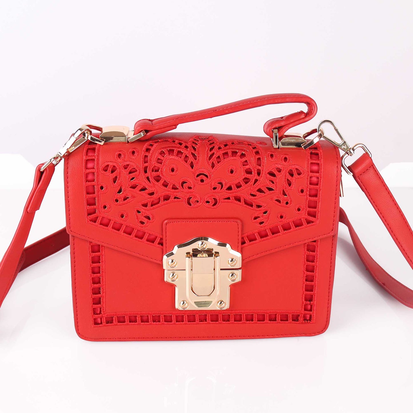 The Punched Sling Bag in Red