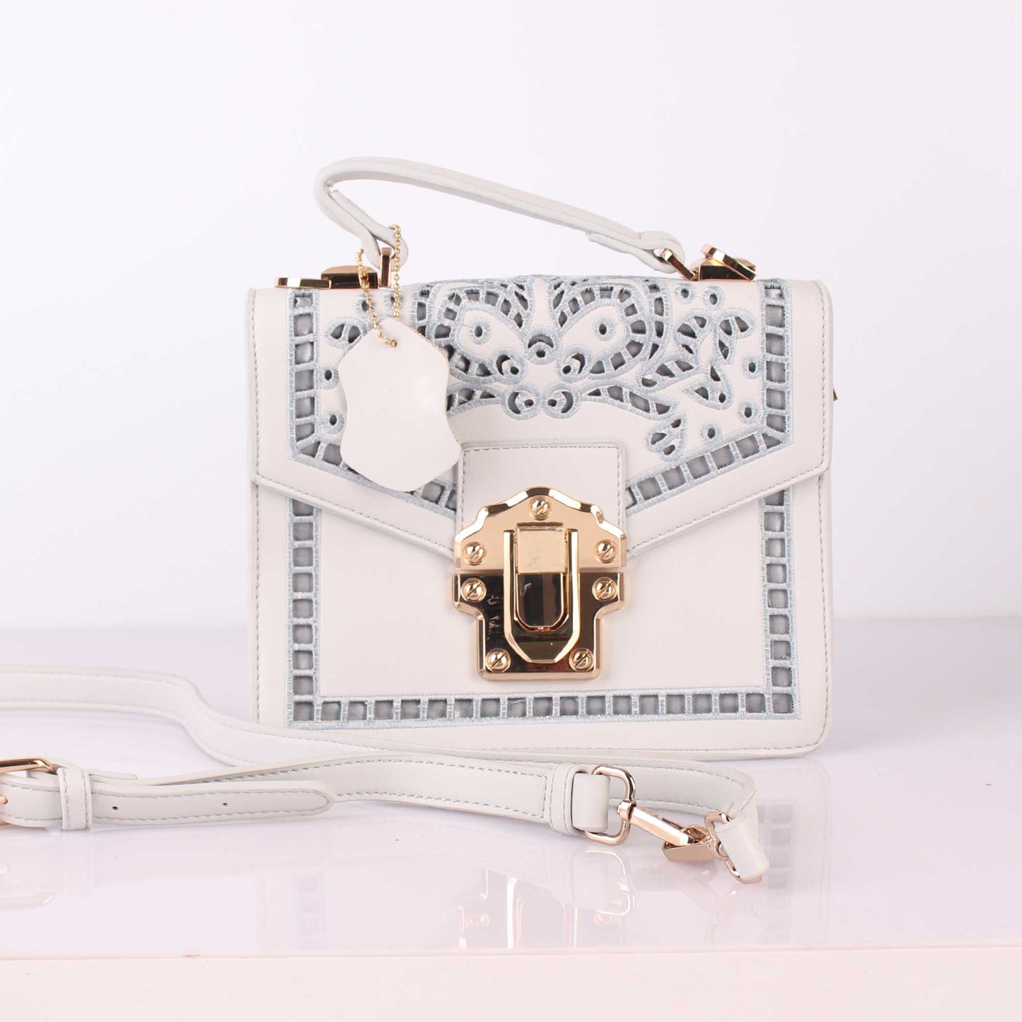 The Punched Sling Bag in White