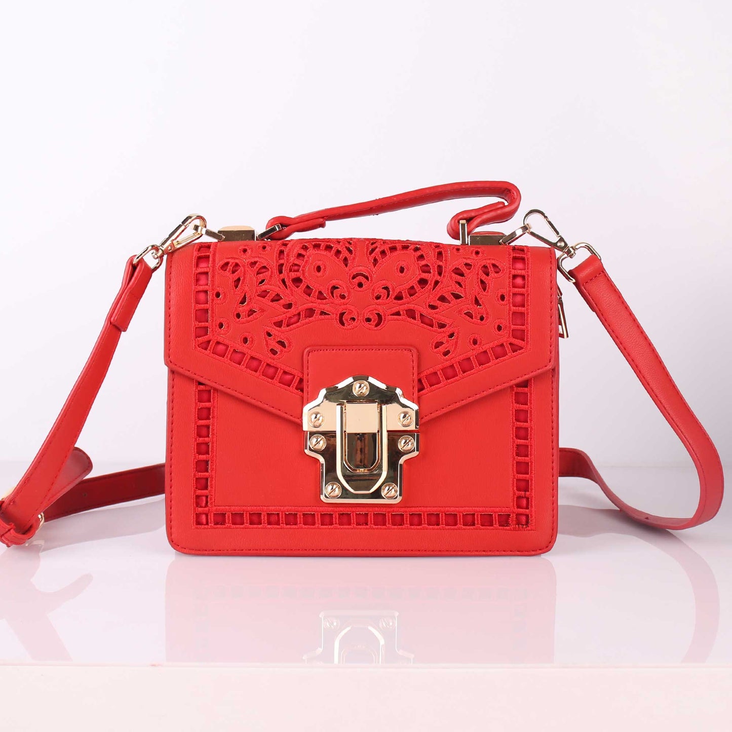The Punched Sling Bag in Red