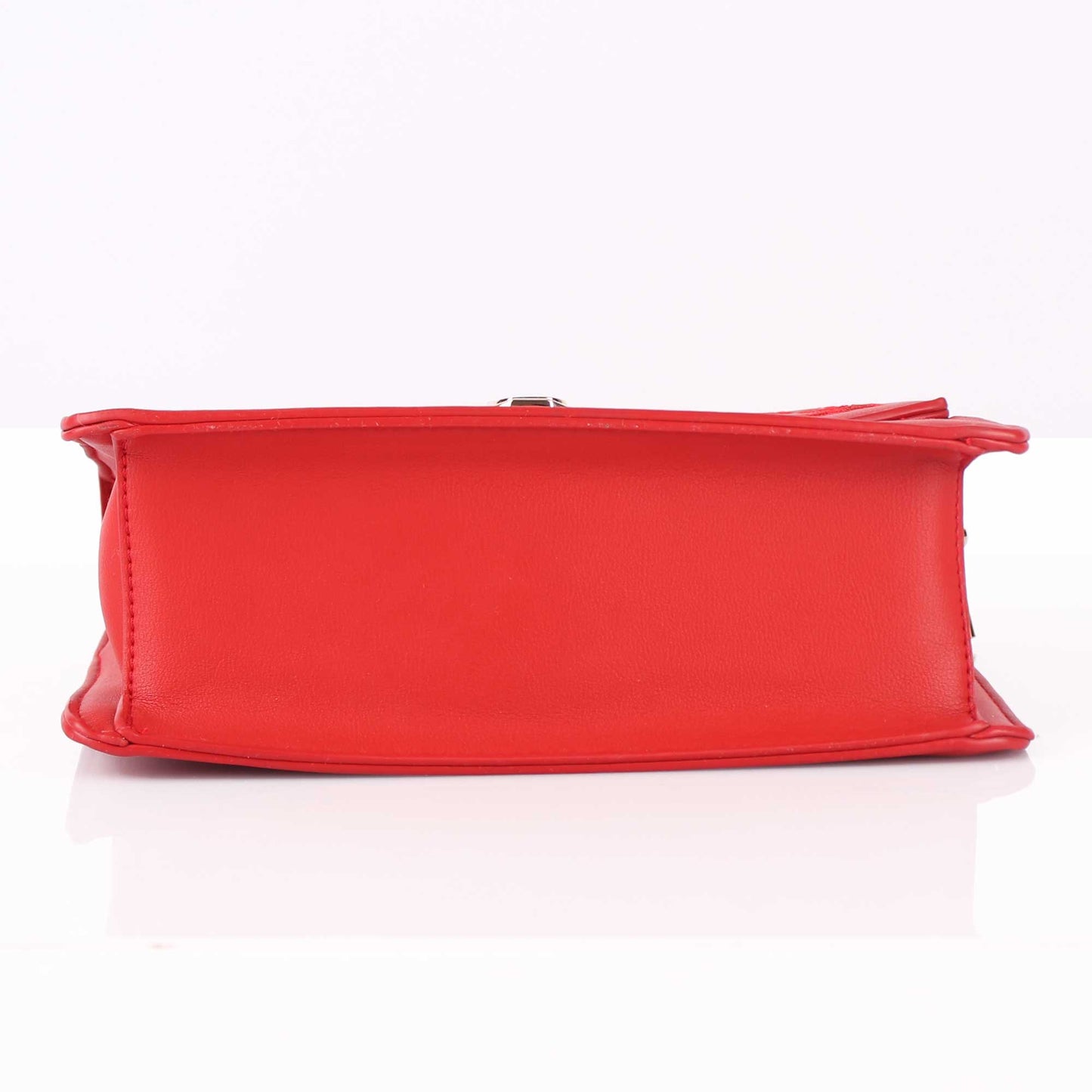 The Punched Sling Bag in Red