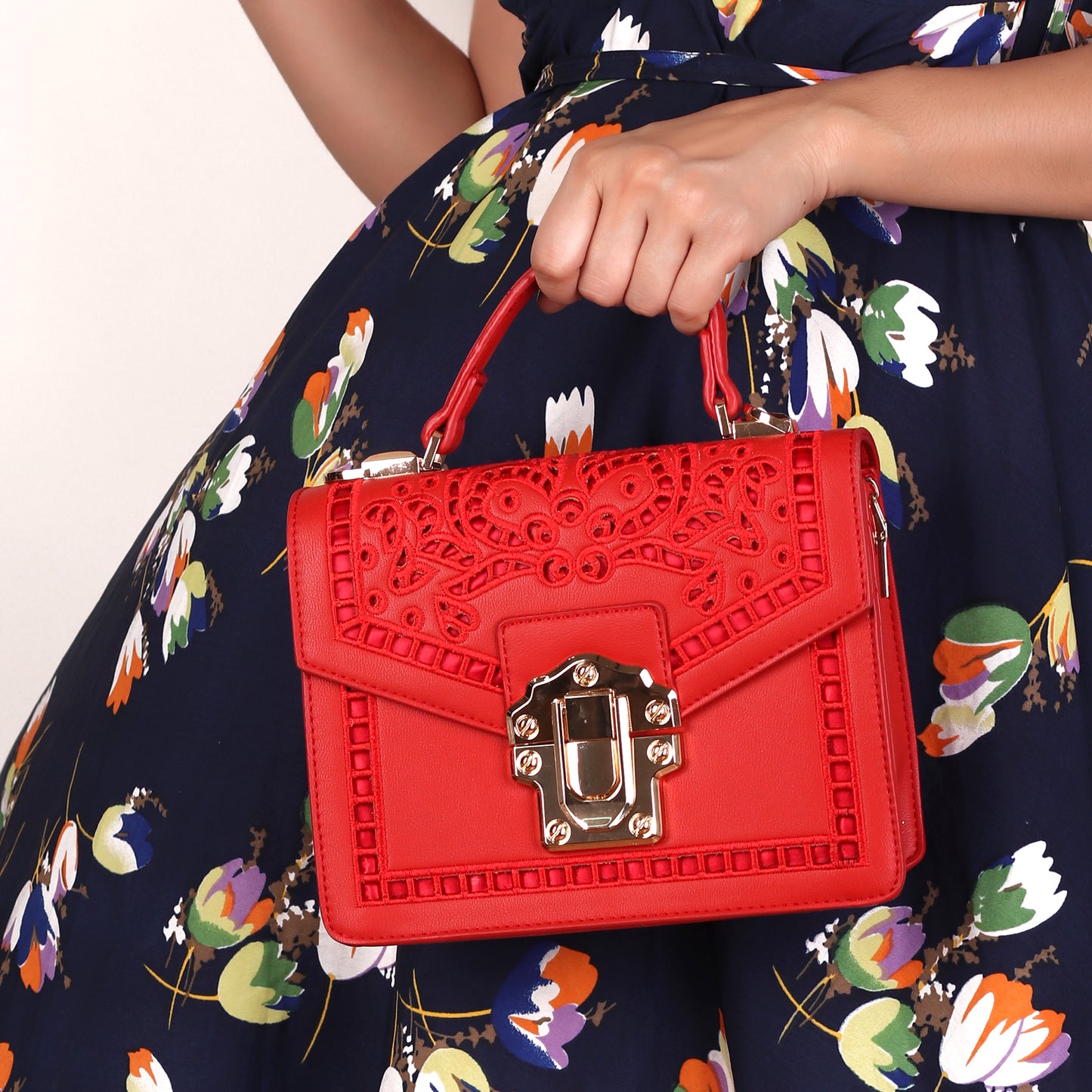 The Punched Sling Bag in Red