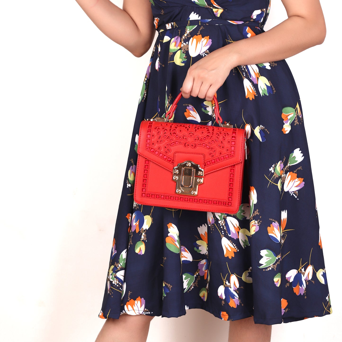 The Punched Sling Bag in Red